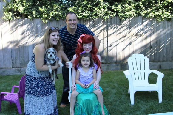 Madelyn poses with Ariel, Prince Eric, and Ursula. Thanksalot.